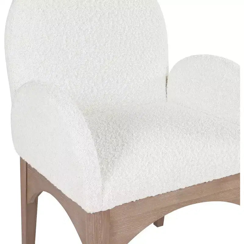 Sedia da pranzo con braccioli in tessuto bouclé nero/crema, 1 posto, gambe in frassino naturale